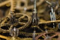 Dirty and Grimy Vintage Metallic Watch Gears on a Black Surface