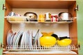 Dirty grubby drainer with clean dishes in kitchen. Royalty Free Stock Photo