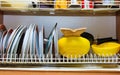 Dirty grubby drainer with clean dishes in kitchen. Royalty Free Stock Photo