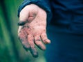 Dirty hand after garden work.