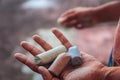 Dirty hands holding colored chalks Royalty Free Stock Photo