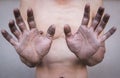 Dirty hands of male workers. Selective focus.