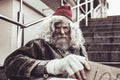 Dirty homeless man looking into the camera with doubt. Royalty Free Stock Photo