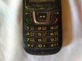 Dirty keypad of old mobile phone, with numbers and alphabets Royalty Free Stock Photo