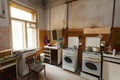 Dirty kitchen with furniture and gas stoves is in the apartment for temporary living existence refugees who were forced to mig Royalty Free Stock Photo