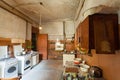 Dirty kitchen with furniture and gas stoves is in the apartment for temporary living existence refugees who were forced to mig Royalty Free Stock Photo