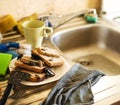 Dirty kitchen pile of filthy dishes infested with roaches, lifestyle concept