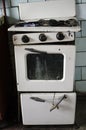 Dirty kitchen. Unsanitary conditions. Old gas stove in emergen