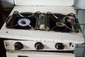 Dirty kitchen. Unsanitary conditions. Old gas stove in emergen