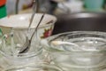 dirty kitchenware partially covered with detergent sud in process of hand wahsing Royalty Free Stock Photo