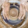 Dirty Male Potter Hands Moulding Jar on Potter`s Wheel Royalty Free Stock Photo