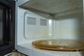 Dirty microwave oven. With burnt paint on the walls and traces of grease Royalty Free Stock Photo