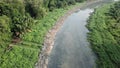 Dirty mud flow at river after widening.