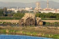 Dirty mud tractor in a rice field and white herons around it in the natrual park of Albufera, Valencia, Spain