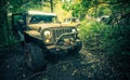 Dirty and Muddy Off-Road Vehicle in the Woods