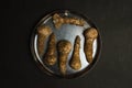 Dirty mushroom in a plate on a black background