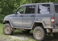 Dirty Off Road Trip. Dirty Full of Mud SUV Type Car Right After Crossing Wet Desert. Royalty Free Stock Photo