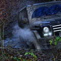 Dirty offroad car, close up. Powerful black car rides