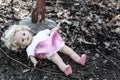 Dirty old abandoned doll Royalty Free Stock Photo