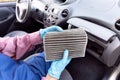 Replacement of dirty cabin pollen air filter for a car Royalty Free Stock Photo