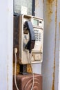 dirty old coin operated public telephone box rusty and disused Royalty Free Stock Photo