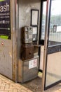 dirty old coin operated public telephone box rusty and disused Royalty Free Stock Photo