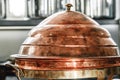 Dirty old copper dome lid cover in kitchen