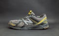 Dirty old New Balance 470 v3 running trainers with holes in on a black background