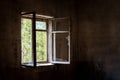 Dirty old open window with broken glass in abandoned house in ghost town Pripyat, Chernobyl Exclusion Zone, Ukraine Royalty Free Stock Photo