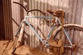 Dirty Old Rusted Bike Leaning Against A Tin Shed