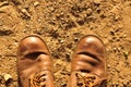 Dirty old shoes on dust floor Royalty Free Stock Photo