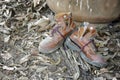 Dirty old shoes on grunge floor. Royalty Free Stock Photo