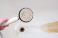 Dirty old shower head close up with limescale and calcified, rusty shower mixer and mould tiles on background, cleaning Royalty Free Stock Photo