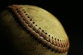 Dirty, old baseball with black background. Royalty Free Stock Photo