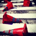 Dirty orange cones in the street