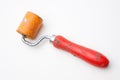 Dirty orange rubber roll with red handle