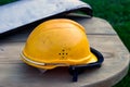 Dirty orange workman`s safety helmet