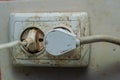 Dirty outlet in dirt and grease from a stove with connected electrical appliances Royalty Free Stock Photo