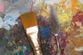 Dirty paint brush and old pallet Royalty Free Stock Photo