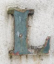 Dirty painted alphabet letter on concrete wall