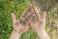 Dirty palms of the child. Dirty hands of a child in the ground. Royalty Free Stock Photo