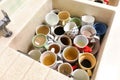 Dirty pile of unwashed cups and mugs in wash basin Royalty Free Stock Photo