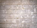 Dirty plaster covered floorboards