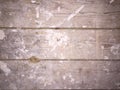 Dirty plaster covered wooden floorboards