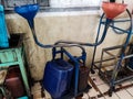 Dirty portable oil container in a workshop