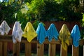 Dirty rags hanging on fence