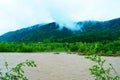 Dirty river current after rain. Mudslide concept. River flow with dirty water after heawy rain Royalty Free Stock Photo