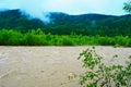 Dirty river current after rain. Mudslide concept. River flow with dirty water after heawy rain Royalty Free Stock Photo