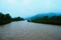 Dirty river current after rain. Mudslide concept. River flow with dirty water after heawy rain Royalty Free Stock Photo