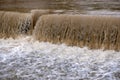 Dirty river current after rain. Mudslide concept. River flow with dirty water after heawy rain. Royalty Free Stock Photo